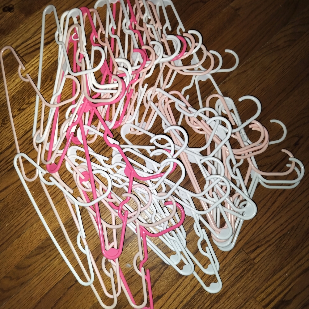 40 Assorted Pink and White Plastic Hangers